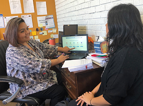 a woman providing assistance to another woman
