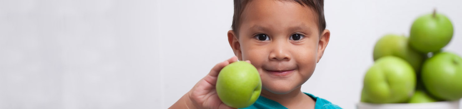 boy holding apple