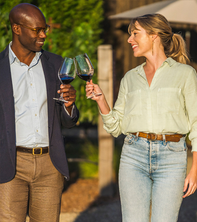 man and woman with glass of wine